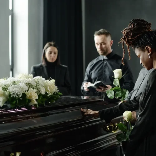young-black-woman-paying-respects-beside-casket-du-2026-01-09-12-11-36-utc